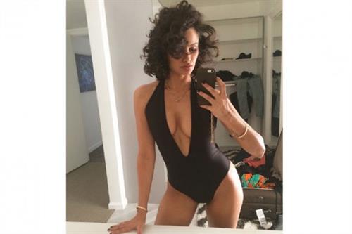 Nazanin Mandi in a bikini taking a selfie