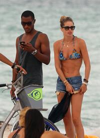 Doutzen Kroes bikini candids on the beach in Miami, Florida Augusts 15, 2012
