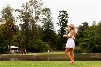 Victoria Azarenka poses with Memorial Cup after winning the 2013 Australian Open January 27, 2013 