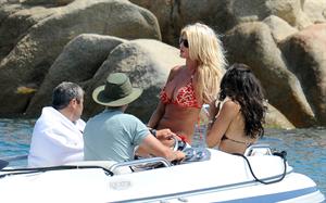 Victoria Silvstedt wearing a bikini on a board in Sardinia on August 8, 2012