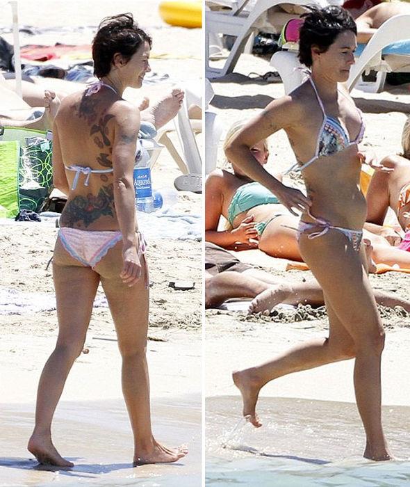 Lena Headey in a bikini - ass