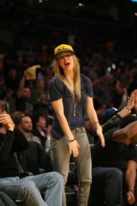 Kaley Cuoco attending a Los Angeles Lakers vs New York Knicks basketball game in LA on December 29, 2011