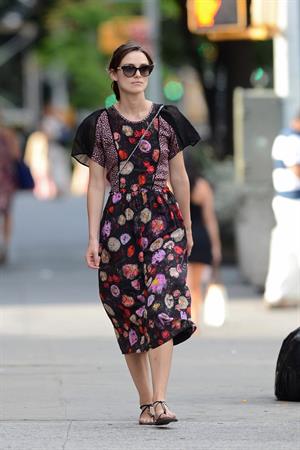 Keira Knightley wears a dark floral dress while strolling in New York City on August 7, 2012