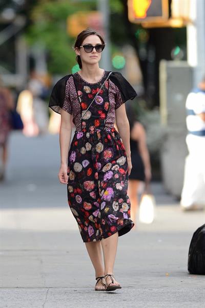 Keira Knightley wears a dark floral dress while strolling in New York City on August 7, 2012