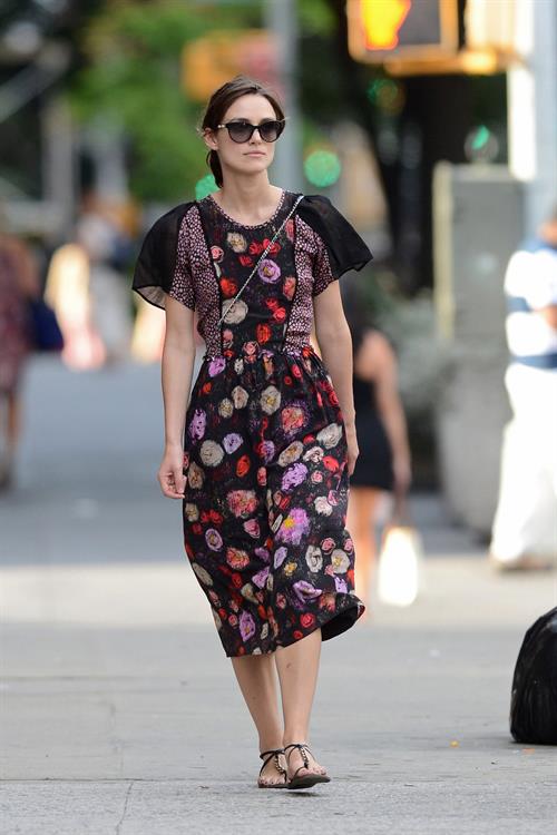 Keira Knightley wears a dark floral dress while strolling in New York City on August 7, 2012