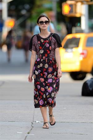 Keira Knightley wears a dark floral dress while strolling in New York City on August 7, 2012