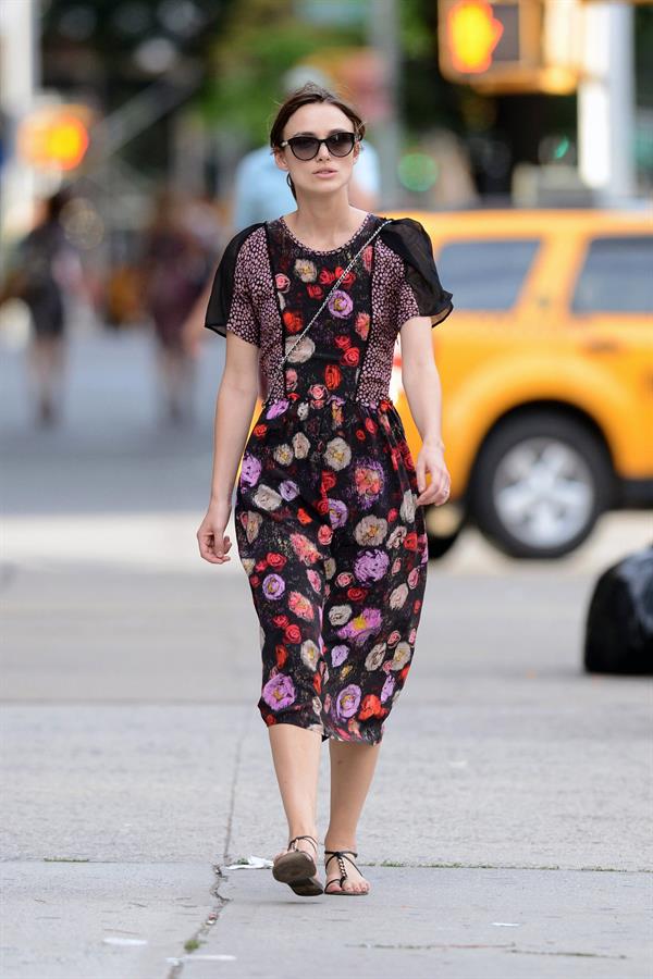 Keira Knightley wears a dark floral dress while strolling in New York City on August 7, 2012