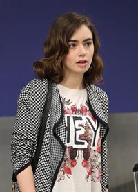 Lily Collins - LAX Airport 8/27/13