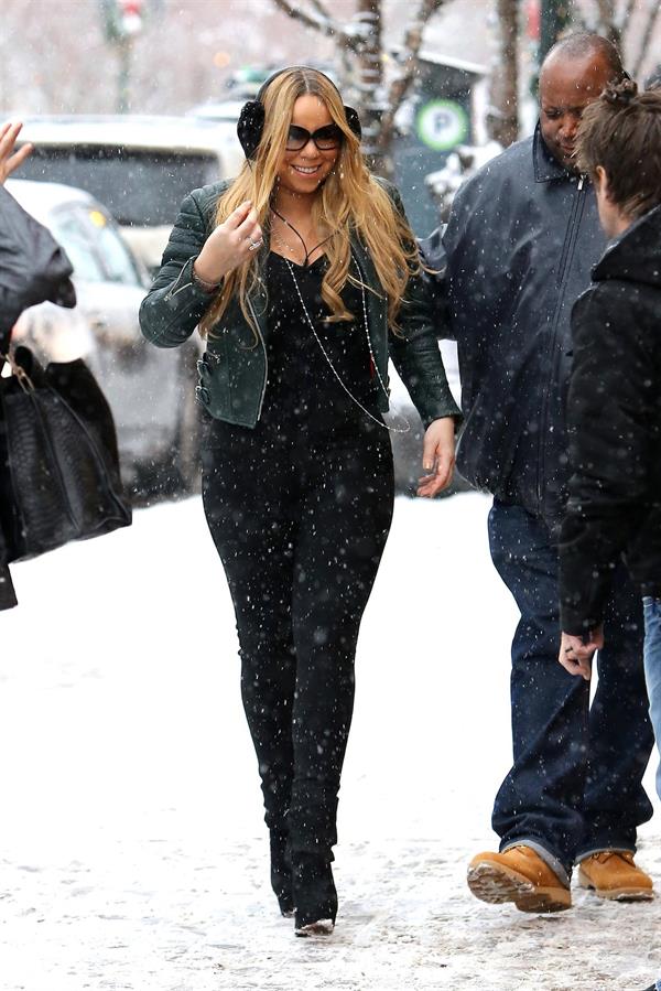 Mariah Carey made another stop at the Louis Vuitton store to shop with a family member. December 24, 2012 