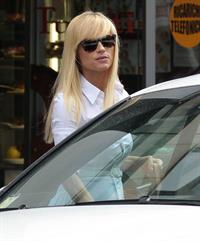 Michelle Hunziker Leaving her house in a white dress in Milan Italy on May 9, 2013