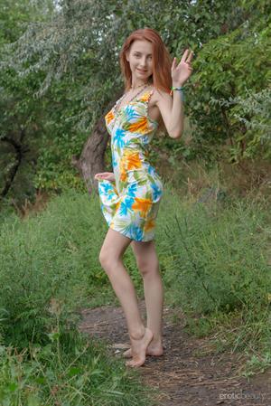 Olivia I in  Little Red  for Erotic Beauty - Olivia I bares her petite body as she dips in the river.