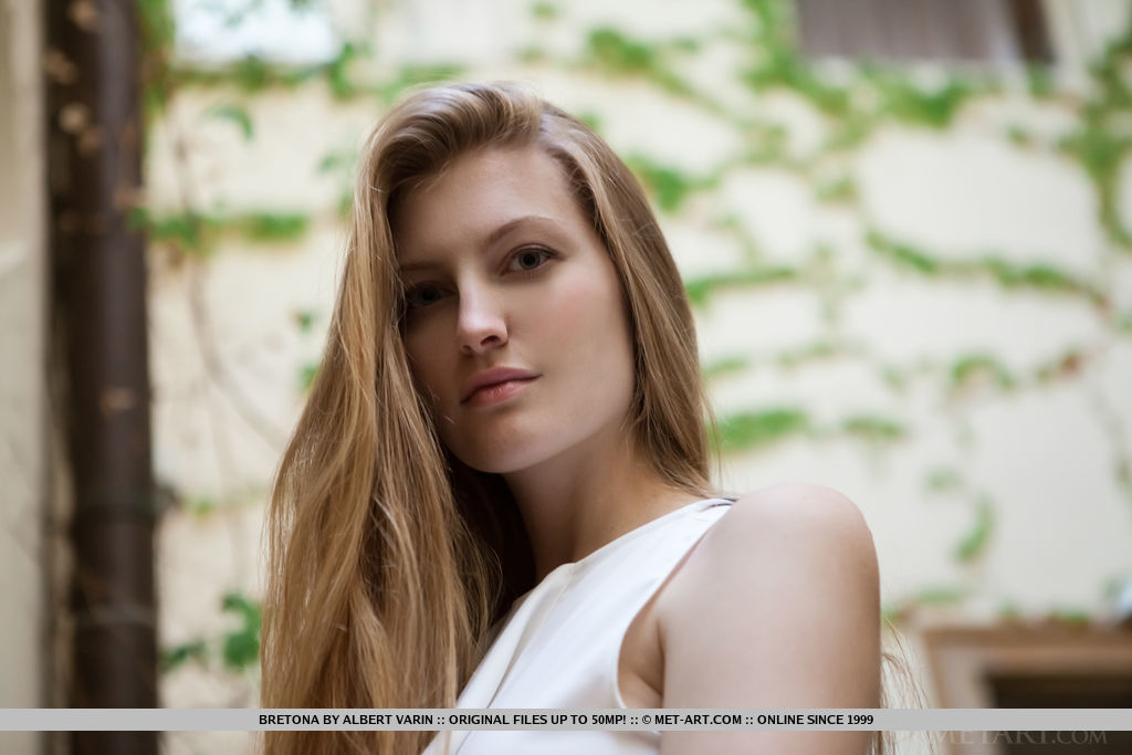 Bretona in  Drioma  for MetArt - Bretona strips her white lingerie baring her wet, pink pussy on the couch.