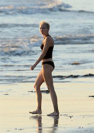Miley Cyrus  yoga in black bikini on beach in Hawaii 1/24/13 