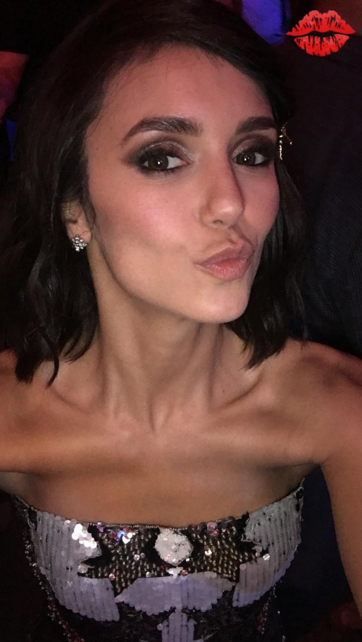 Nina Dobrev taking a selfie