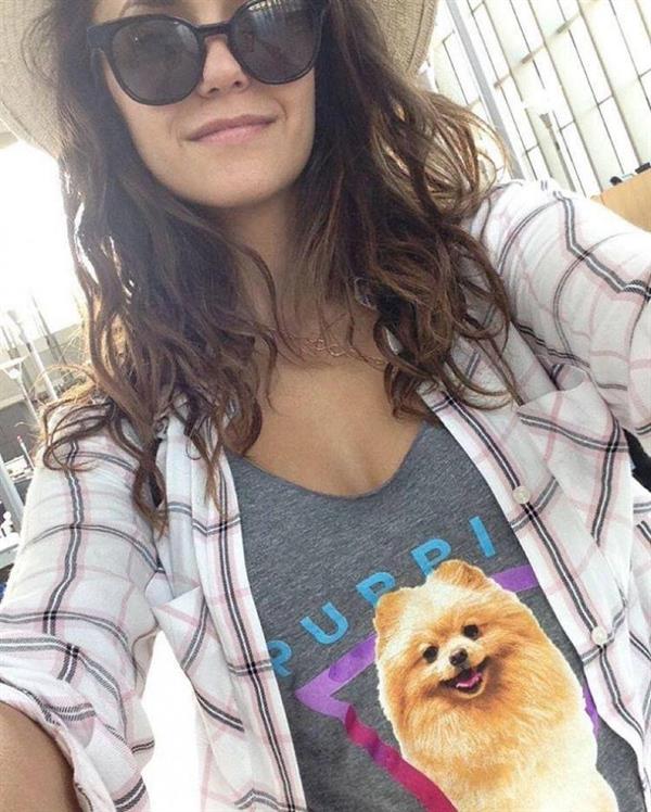 Nina Dobrev taking a selfie