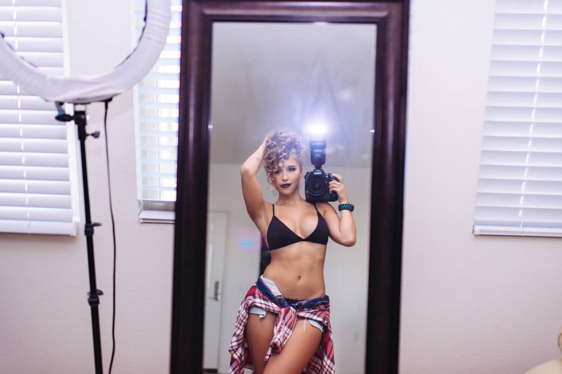 Tianna Gregory in a bikini taking a selfie