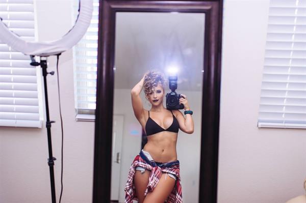Tianna Gregory in a bikini taking a selfie