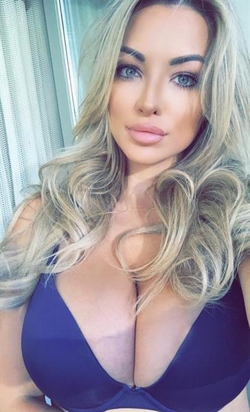 Lindsey Pelas in a bikini taking a selfie