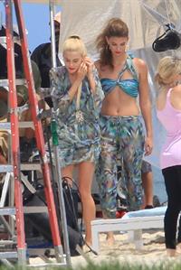 Minka Kelly and Rachael Taylor film Charlie's Angels on a beach in Miami 02-09-11