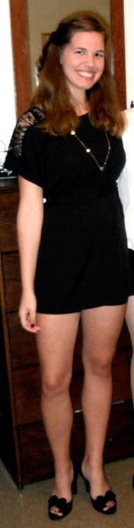 Showing off her great legs in a little black dress