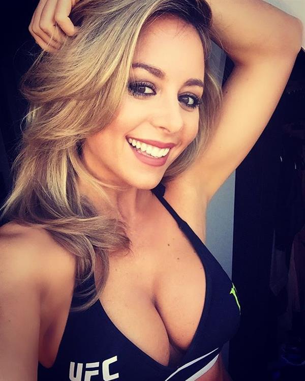 Carly Baker in a bikini taking a selfie