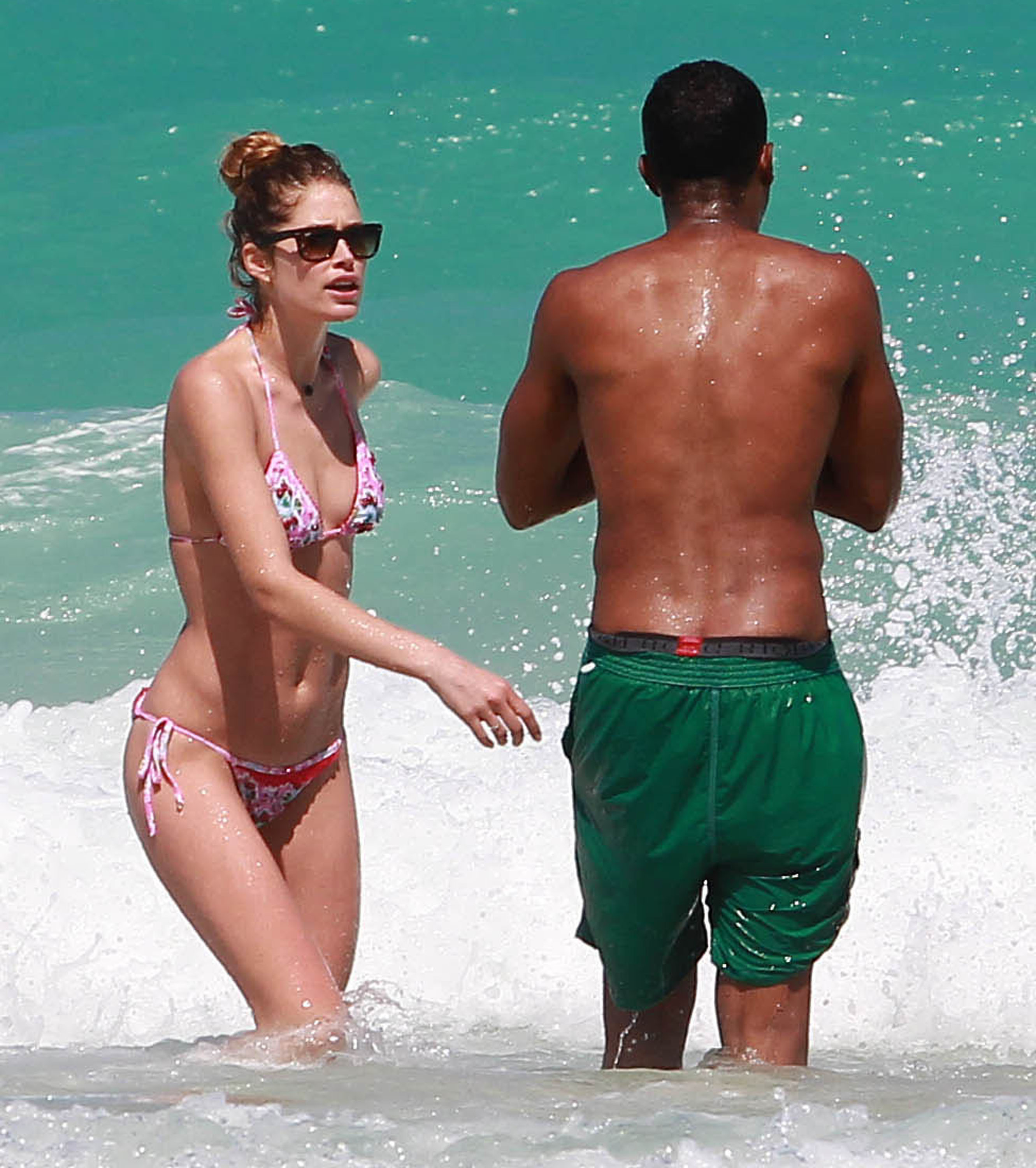 Doutzen Kroes enjoys a day on the beach in Miami Beach, FL on April 28, 2013