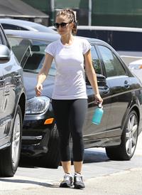 Minka Kelly leaving the gym in West Hollywood wearing a white shirt and black pants