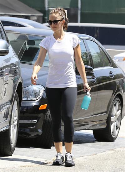 Minka Kelly leaving the gym in West Hollywood wearing a white shirt and black pants