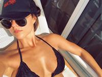 Rhiannon Fish in a bikini taking a selfie