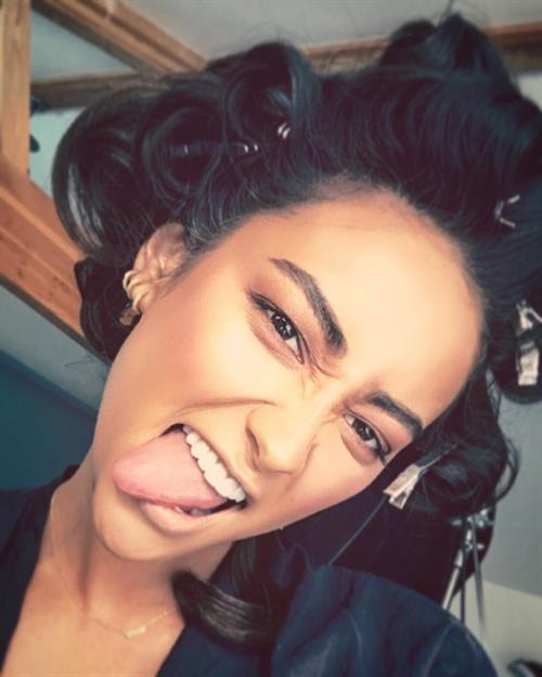 Shay Mitchell taking a selfie