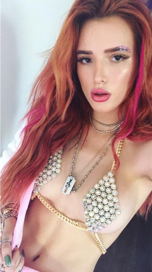 Bella Thorne in a bikini taking a selfie