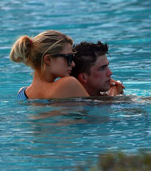 Paris Hilton spends the day in and out of the pool in Miami December 8, 2012