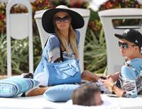 Paris Hilton spends the day in and out of the pool in Miami December 8, 2012