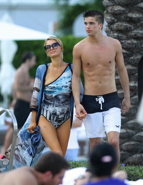 Paris Hilton spends the day in and out of the pool in Miami December 8, 2012