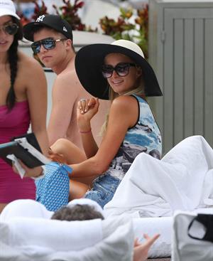 Paris Hilton spends the day in and out of the pool in Miami December 8, 2012