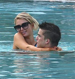 Paris Hilton spends the day in and out of the pool in Miami December 8, 2012