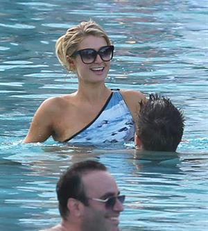 Paris Hilton spends the day in and out of the pool in Miami December 8, 2012