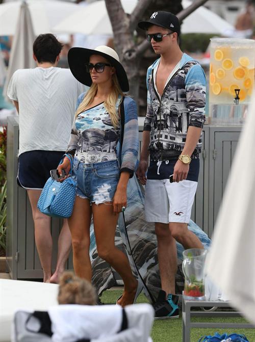Paris Hilton spends the day in and out of the pool in Miami December 8, 2012