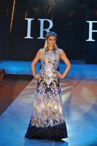 Paris Hilton walks for designer duo Shane and Falguni Peacock and performs as a DJ at the India Resort Fashion Week