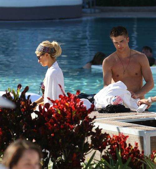 Paris Hilton poolside at their Miami hotel December 7-2012 