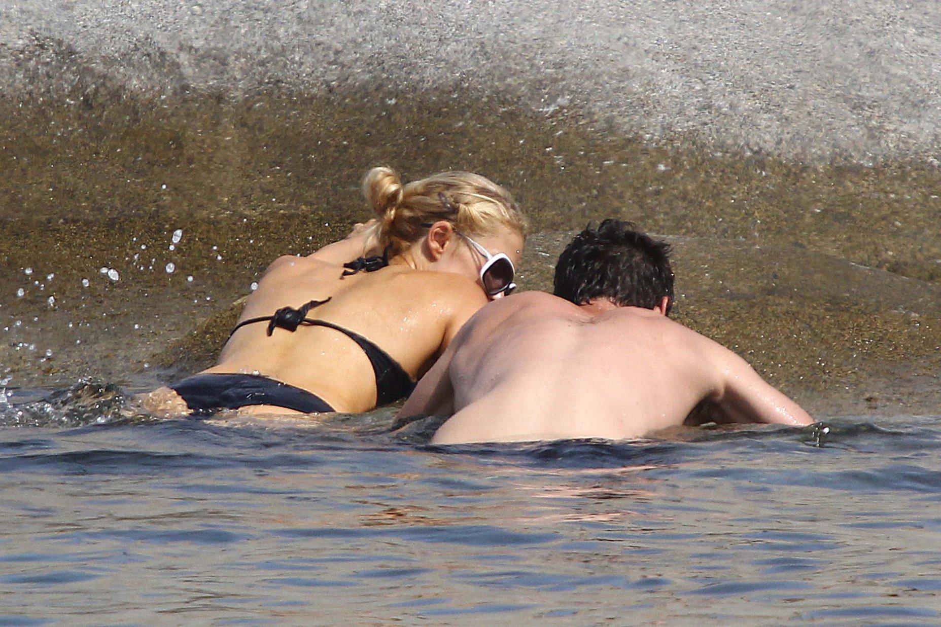Paris Hilton - Wearing a swimsuit at a beach in France August 6, 2012