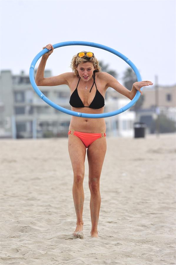 Estella Warren in a bikini with a hula hoop in Venice Beach on August 12, 2014