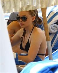 Chloe Grace Moretz candids in a Black Bikini in Miami Beach