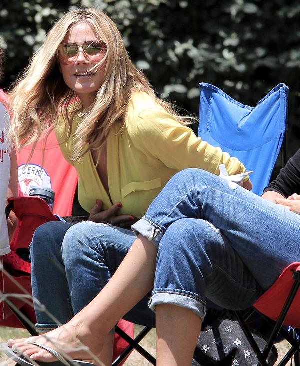 Heidi Klum out for lunch in Brentwood in a yellow shirt