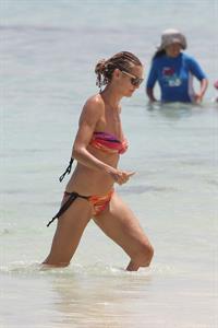 Heidi Klum wearing a bikini on a beach in the Bahamas on July 6, 2013
