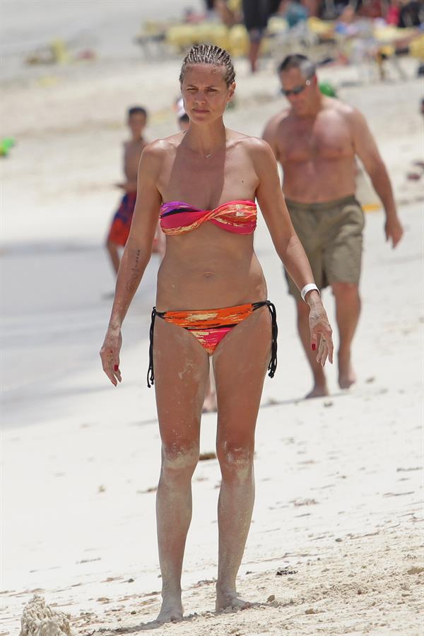 Heidi Klum wearing a bikini on a beach in the Bahamas on July 6, 2013