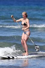 Ireland Baldwin goes paddle-boarding in Hawaii with her boyfriend Slater Trout May 26, 2013 