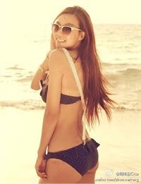 Zhou Wei Tong in a bikini - ass