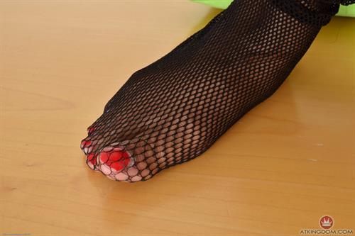 Monique Symone in fishnet stockings