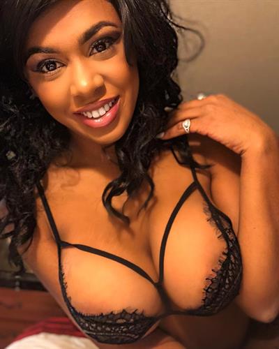 Megan Ashli in lingerie taking a selfie